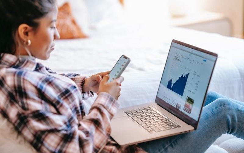 Woman checking stock prices