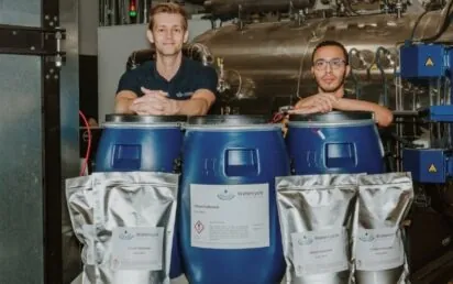 Seb Leaper is pictured alongside his co-founder Dr Ahmed Abdelkarim next to the recently produced 100kg battery-grade lithium carbonate