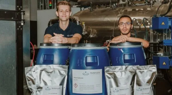 Seb Leaper is pictured alongside his co-founder Dr Ahmed Abdelkarim next to the recently produced 100kg battery-grade lithium carbonate