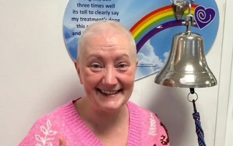 Kate Rothwell rings the bell to signal the end of her treatment