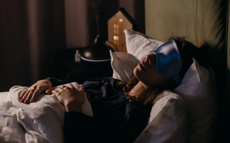 Woman sleeping in mask