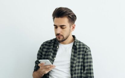 Man looking at iPhone