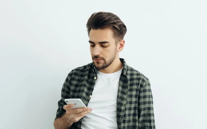 Man looking at iPhone