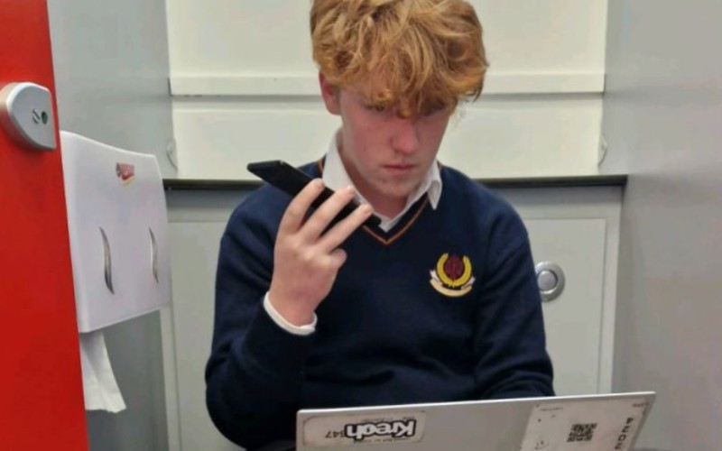 Liam Fuller became a viral star when he shared a photo of himself taking a sales call on his school toilet,