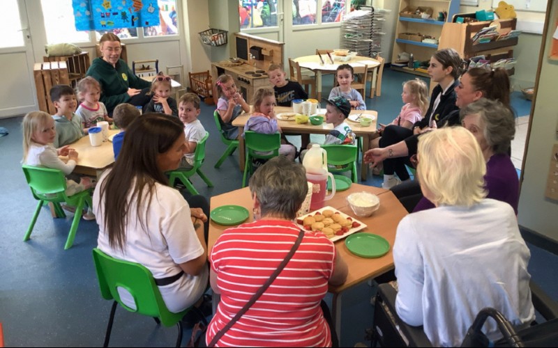 Residents of nursing home visit Sunflower Childcare Group