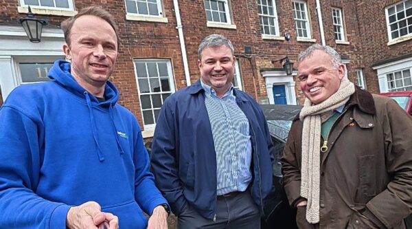 Mark Hewitt, centre, and David Richards MBE, right, of Lexcelerate with Jonathan Symcox of BusinessCloud