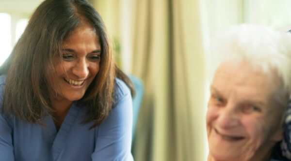 Elderly person with nurse - credit Age Cymru on Unsplash