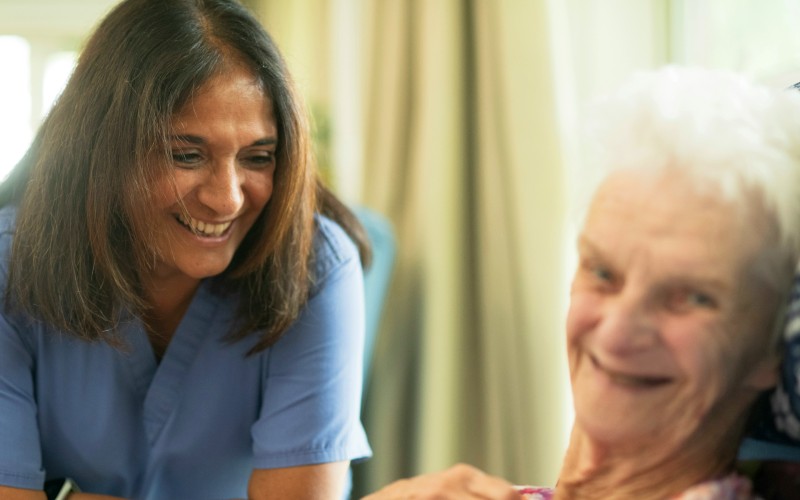 Elderly person with nurse - credit Age Cymru on Unsplash