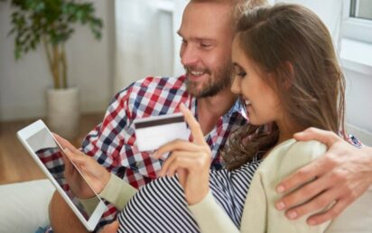 Pregnant couple paying online