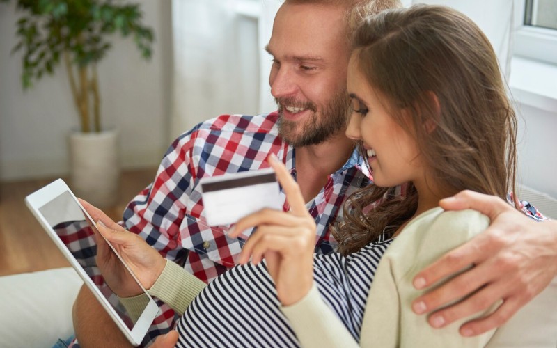 Pregnant couple paying online