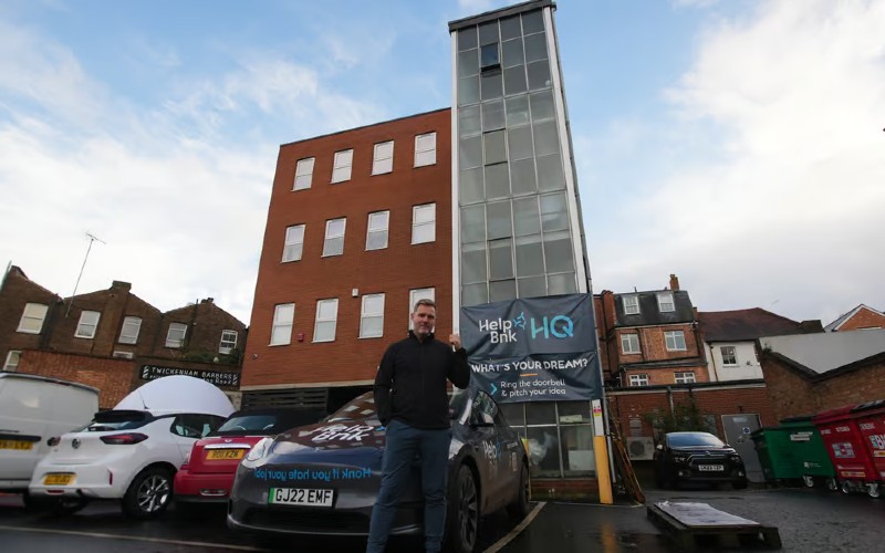 Simon Squibb, co-founder of Helpbnk, with Doorbell of Dreams staircase