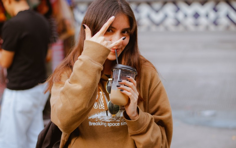 Girl drinking iced coffee. Credit César O'Neill, Pexels
