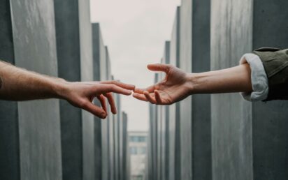Hands reaching out - credit Toa Heftiba, Unsplash